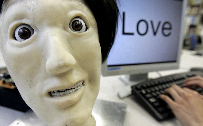A humanoid robot named Kansei, meaning "sensibility" in Japanese, makes a facial expression depicting "happiness", next to the word "Love" during a demonstration at a laboratory of Meiji University's Robot and Science Institute in Kawasaki, south of Tokyo in this June 4, 2007 file photo. Three-fourths of robot installations over the next decade are expected to be concentrated in four areas: transportation equipment, including the automotive sector; computer and electronic products; electrical equipment and machinery. Labor costs have climbed in countries such as China that have been popular for outsourcing production, while technological advances for robots allow them to be more flexible and perform more tasks. REUTERS/Yuriko Nakao/Files ATTENTION EDITORS - THIS PICTURE IS PART OF THE PACKAGE "RISE OF THE MACHINES". TO FIND ALL 20 IMAGES SEARCH 'TECHNOLOGY ROBOTS'.