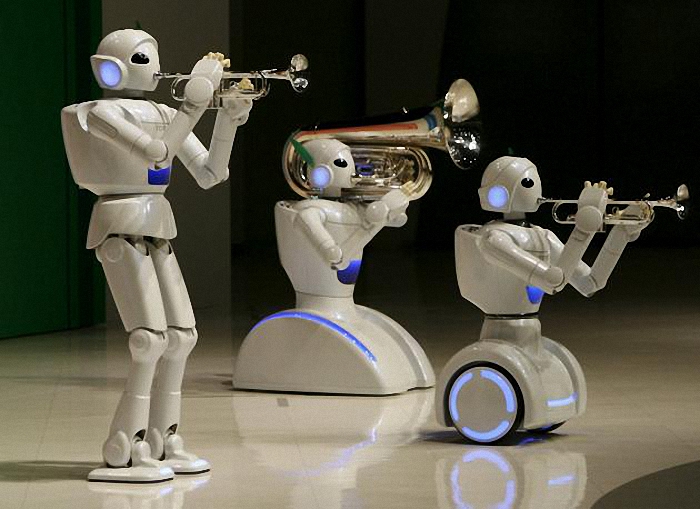 Toyota Motor Corp's partner robots play instruments at the company's showroom in Tokyo, in this May 4, 2008 file photo. Three-fourths of robot installations over the next decade are expected to be concentrated in four areas: transportation equipment, including the automotive sector; computer and electronic products; electrical equipment and machinery. Labor costs have climbed in countries such as China that have been popular for outsourcing production, while technological advances for robots allow them to be more flexible and perform more tasks. REUTERS/Toru Hanai/Files ATTENTION EDITORS - THIS PICTURE IS PART OF THE PACKAGE "RISE OF THE MACHINES". TO FIND ALL 20 IMAGES SEARCH 'TECHNOLOGY ROBOTS'.
